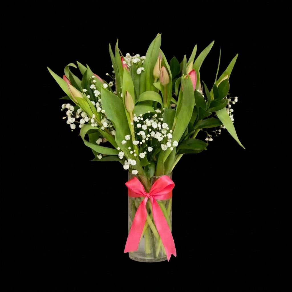 Simple floral arrangement of 10 fresh tulips in a vase for an elegant everyday gift.
