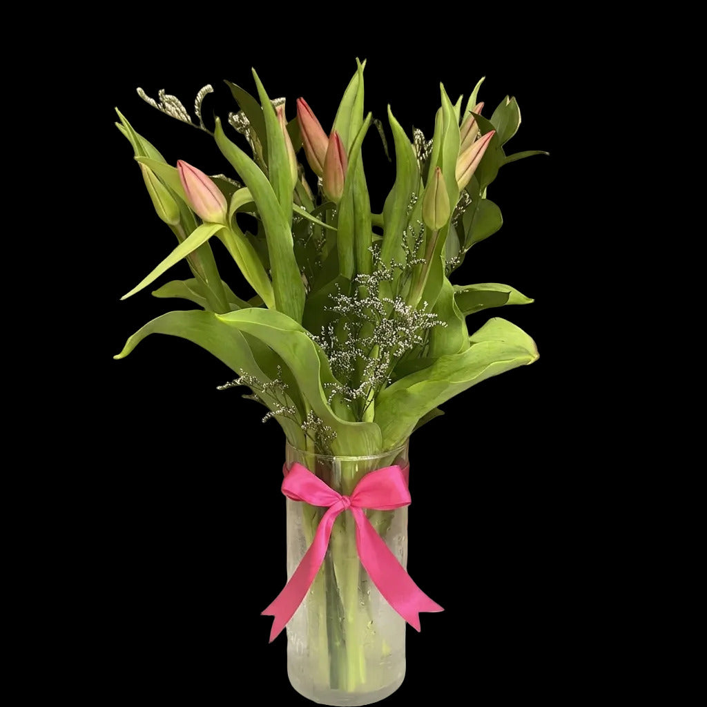 Ten tulips in a vase offered by Bouquets Flowers for gifting to someone special in Doral, Florida.