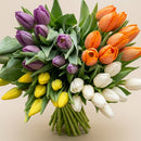 Arrangement of 10 fresh tulips in a vase by Bouquets Flowers, available as a floral gift in Miami and Doral.