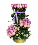 Impresionante arreglo de rosas moradas