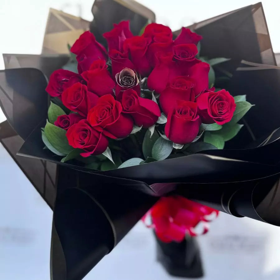 24 Red Roses in Buchon, intricately handcrafted with special papers, Miami roses and romantic gifts delivery service, bring a touch of romance to any occasion and leave a lasting impression with this stunning bouquet. Bouquets Flowers Miami