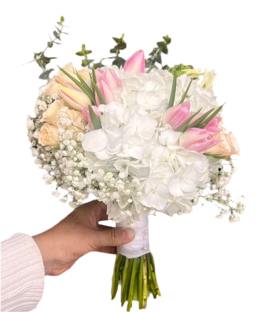 A bouquet of fresh and delicate flowers, including peonies and gardenias, that will make your special day even more magical. Order now at BouquetsFlowers.com and have it delivered to Miami.