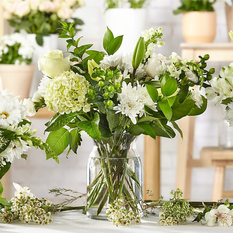 
                  
                    Classic White Premium Flowers Bouquet And Vase, The Colors And Floral Kinds Utilized In This Bouquet Will Vary Depending On Availability And Freshness, Bouquets Flowers in Coral Gables, Miami, Delivery Flowers, Florist in Coral Gables.
                  
                