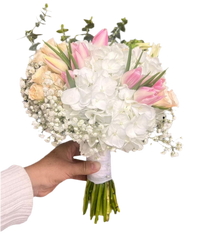 A bouquet of white roses and lilies that symbolizes pure and eternal love. Available at BouquetsFlowers.com and delivered to your doorstep in Miami.