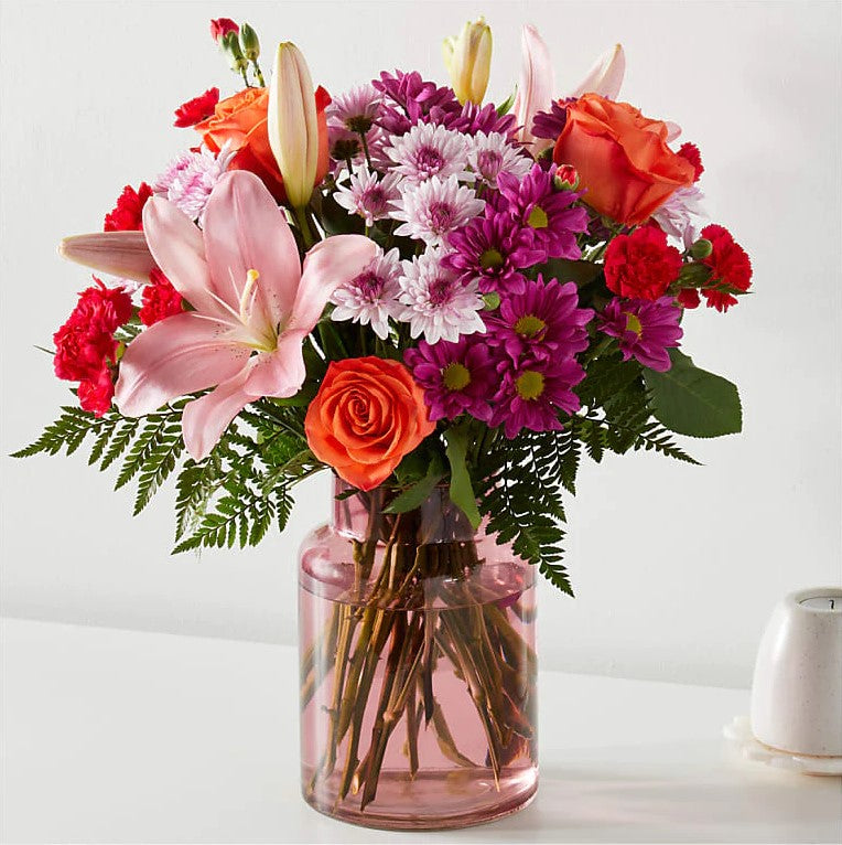 
                  
                    Flash of love Flowers Deluxe With Blush  Vase, Blooms With Vibrant Color And a Sweet Sophistication To Make An Unforgettable Impression! Pink Lilies Dance Over The Distinctive Arrangement Of This Flower Bouquet, Which Is Surrounded By Orange Roses, Lavender Cushion Poms, Hot Pink Carnations, And Rich Greenery. Bouquets Flowers in Coral Gables, Miami, Delivery Flowers, Florist in Coral Gables.
                  
                