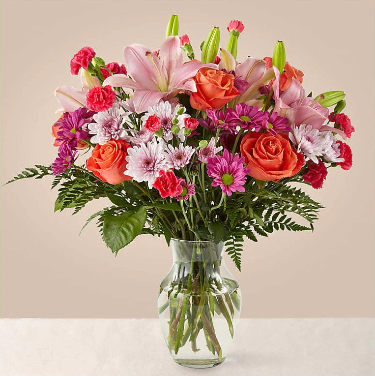 
                  
                    Flash of love Flowers Premium Bouquet And Vase, Blooms With Vibrant Color And a Sweet Sophistication To Make An Unforgettable Impression! Pink Lilies Dance Over The Distinctive Arrangement Of This Flower Bouquet, Which Is Surrounded By Orange Roses, Lavender Cushion Poms, Hot Pink Carnations, And Rich Greenery. Bouquets Flowers in Coral Gables, Miami, Delivery Flowers, Florist in Coral Gables.
                  
                