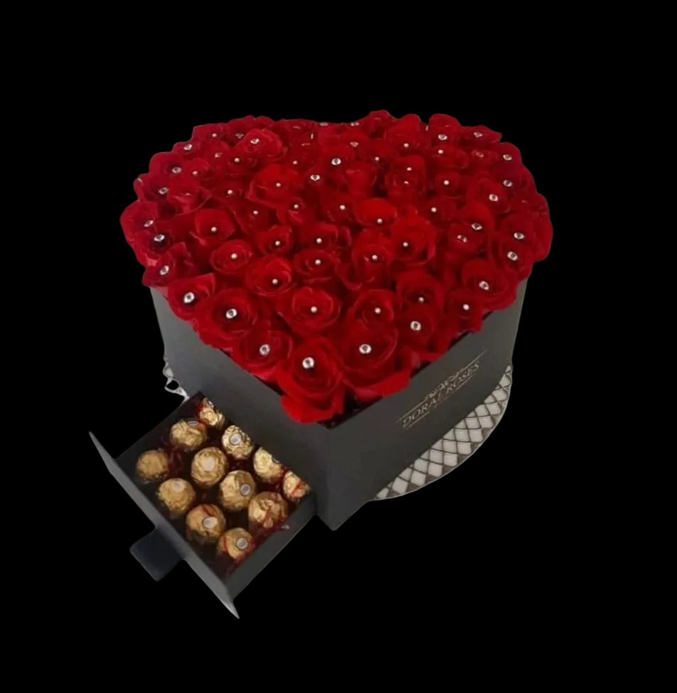 A sculptural expression of elegance and intention.

The Heart 100 – Signature Rose Box is composed of approximately one hundred premium roses, arranged in a refined heart-shaped structure that balances symmetry, depth, and softness.

Each rose is selected for its form and tone, creating a composition that feels both abundant and controlled — designed not simply to impress, but to remain present.

Presented in a luxury hat box, this piece reflects a quiet, elevated aesthetic rooted in our Midtown Miami studi
