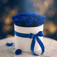 El uxury preserved blue roses in an elegant white box, designed for exclusive floral gifting in Doral.