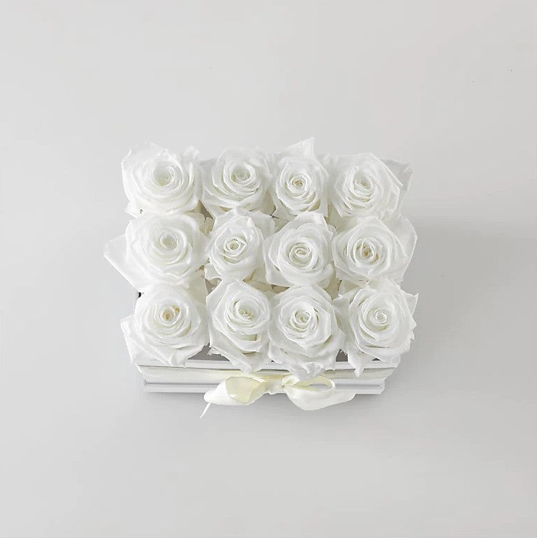 
                  
                    12 White Forever Roses, Observe How The Ivory Petals Of The White Forever Roses Remain As Clean As Snow Regardless Of The Season. These 100% Natural Flowers Are Maintained In Their Prime For More Than Two Years Of Splendour, Special Rose Bouquets And Arrangements, Rose Delivery, Anniversary Flowers & Gifts, Romantic Flowers & Gifts, Mother´s Day, Valentine’s Day. Bouquets Flowers in Coral Gables, Miami, Delivery Flowers, Florist in Coral Gables.
                  
                