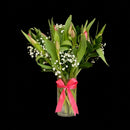 Simple floral arrangement of 10 fresh tulips in a vase for an elegant everyday gift.