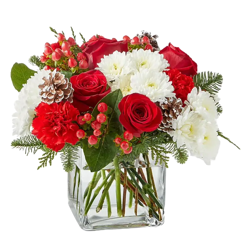 
                  
                    Fotografía del producto con flores "Ángel de Navidad" elaborado con rosas, claveles, margaritas y acompañamiento verde, en un jarrón pequeño de vidrio. Tamaño Deluxe, floristería en Miami, Bouquets Flowers.
                  
                