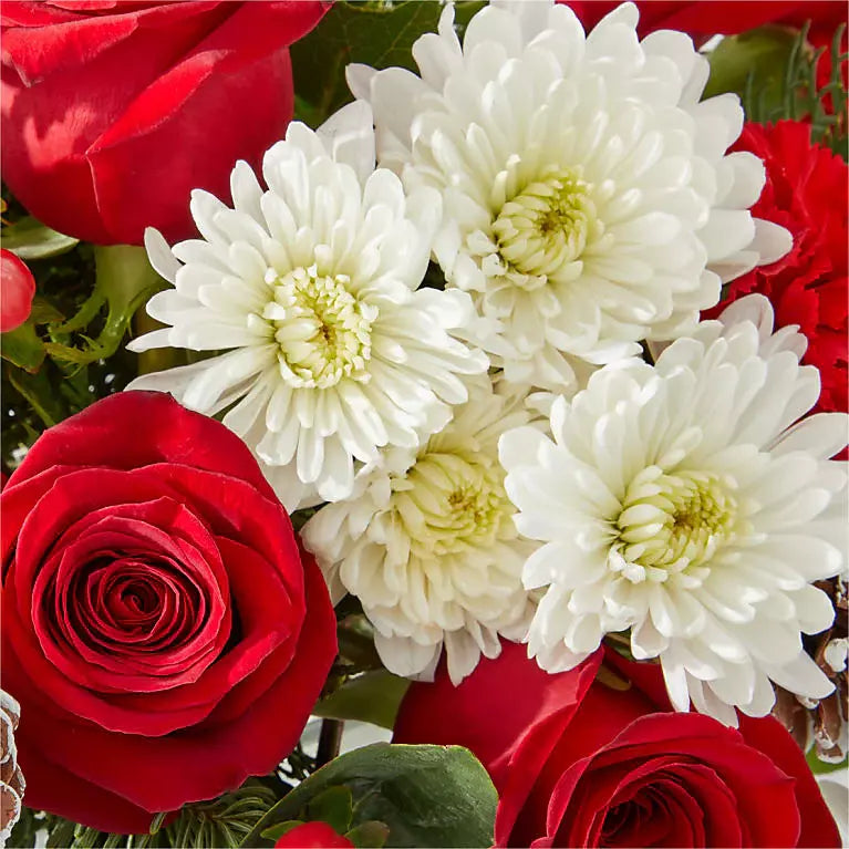 
                  
                    "Christmas Angel" decorated with roses, carnations, daisies and greenery in a small glass vase. Detail with roses, Miami Florist, Bouquets Flowers.
                  
                