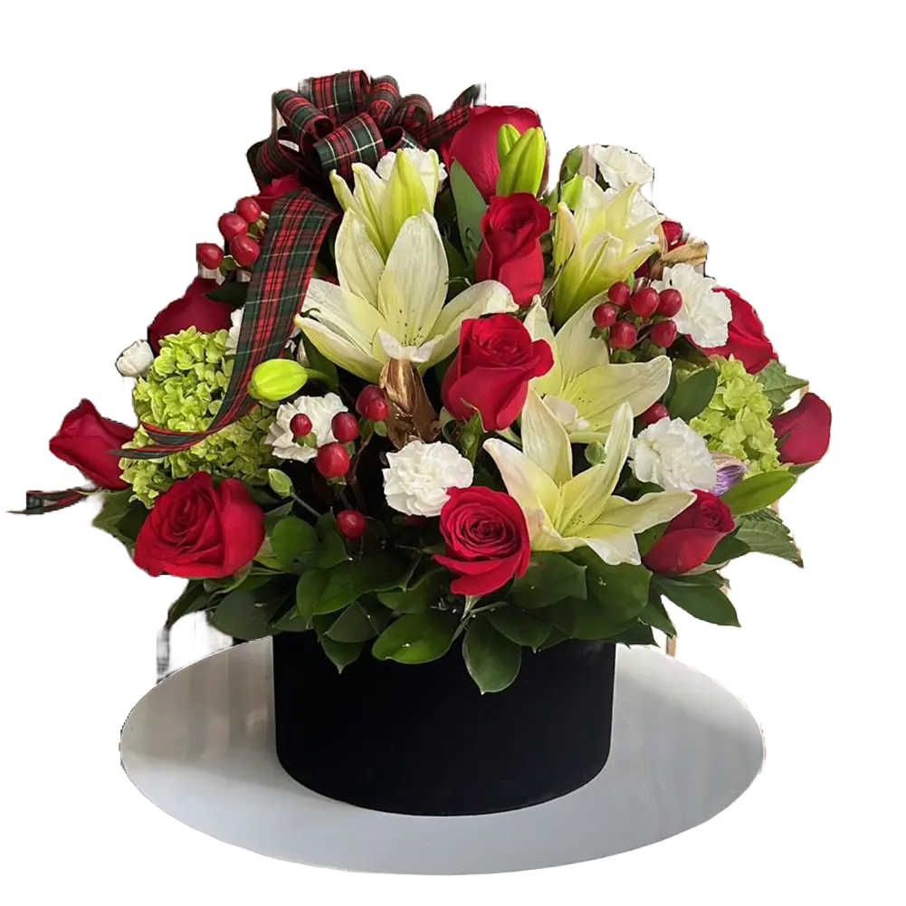 The image is of our floral arrangement with roses, lilies and carnations, we decorate them in a box with a Christmas theme, our flower shop is located in Doral, Miami. Bouquets Flowers