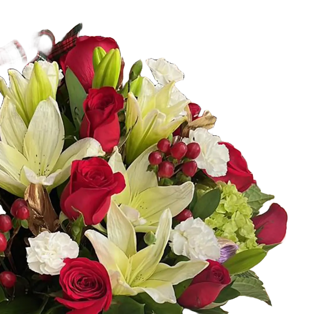 The image is of our floral arrangement with roses, lilies and carnations, we decorate them in a box with a Christmas theme, our flower shop is located in Doral, Miami. Bouquets Flowers. Detail view of the roses, lilies and carnations.