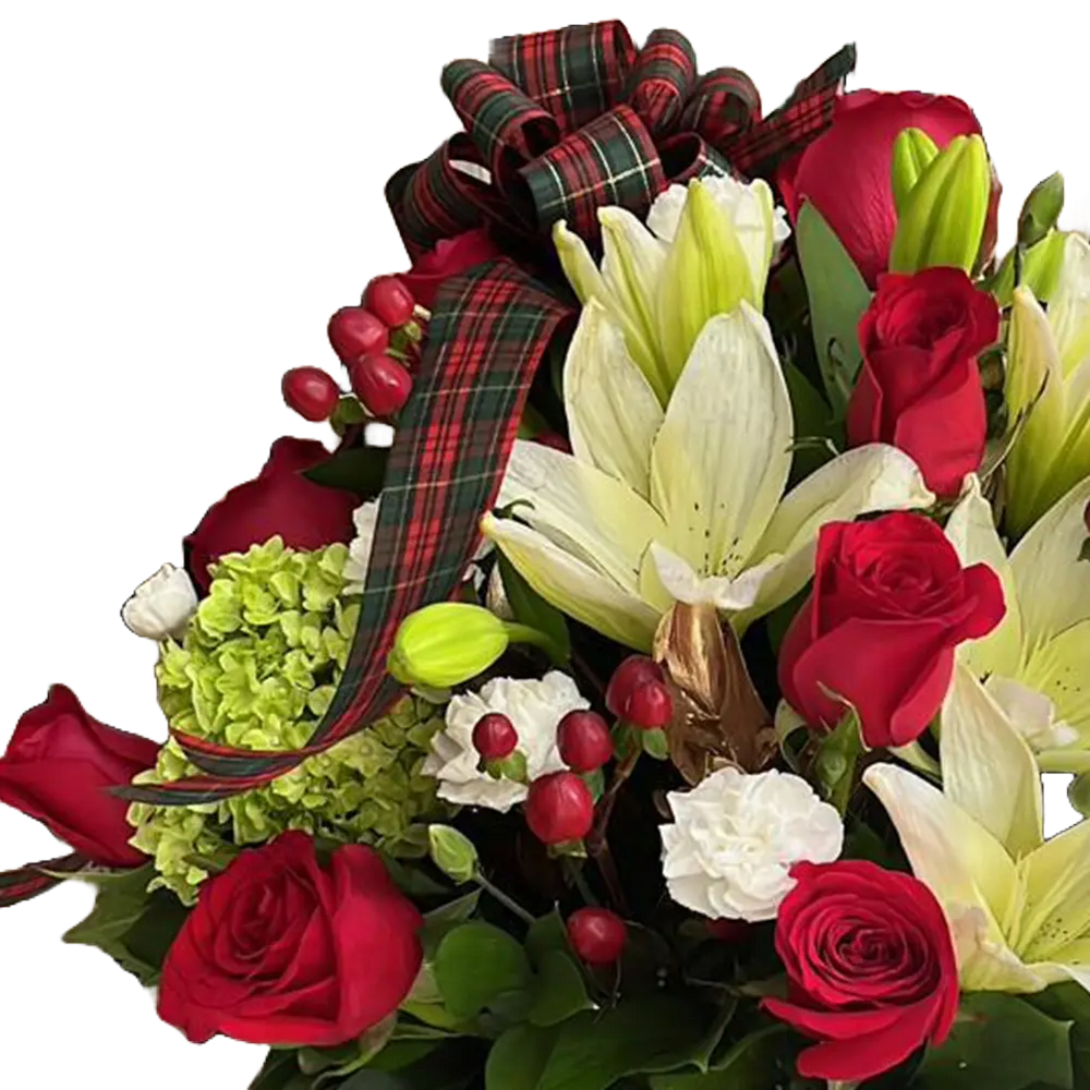 
                  
                    The image is of our floral arrangement with roses, lilies and carnations, we decorate them in a box with a Christmas theme, our flower shop is located in Doral, Miami. Bouquets Flowers. Detail view of the roses, lilies and carnations.
                  
                