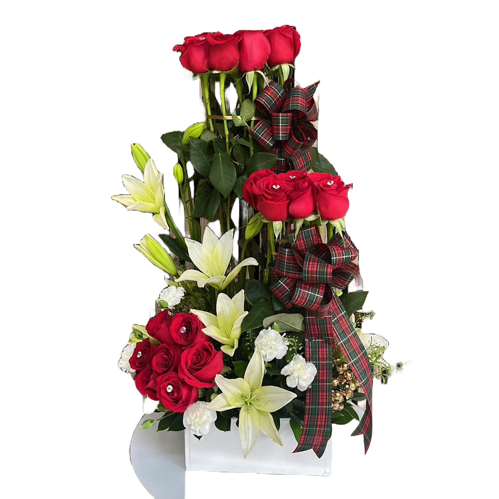 This image represents our Christmas flowers, we made it with red roses and white lilies on a white wooden base. Our flower shop is located in Miami and Bogota. Bouquets Flowers