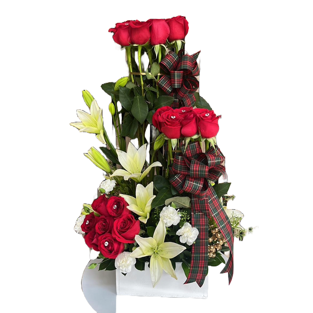 This image represents our Christmas flowers, we made it with red roses and white lilies on a white wooden base. Our flower shop is located in Miami and Bogota. Bouquets Flowers