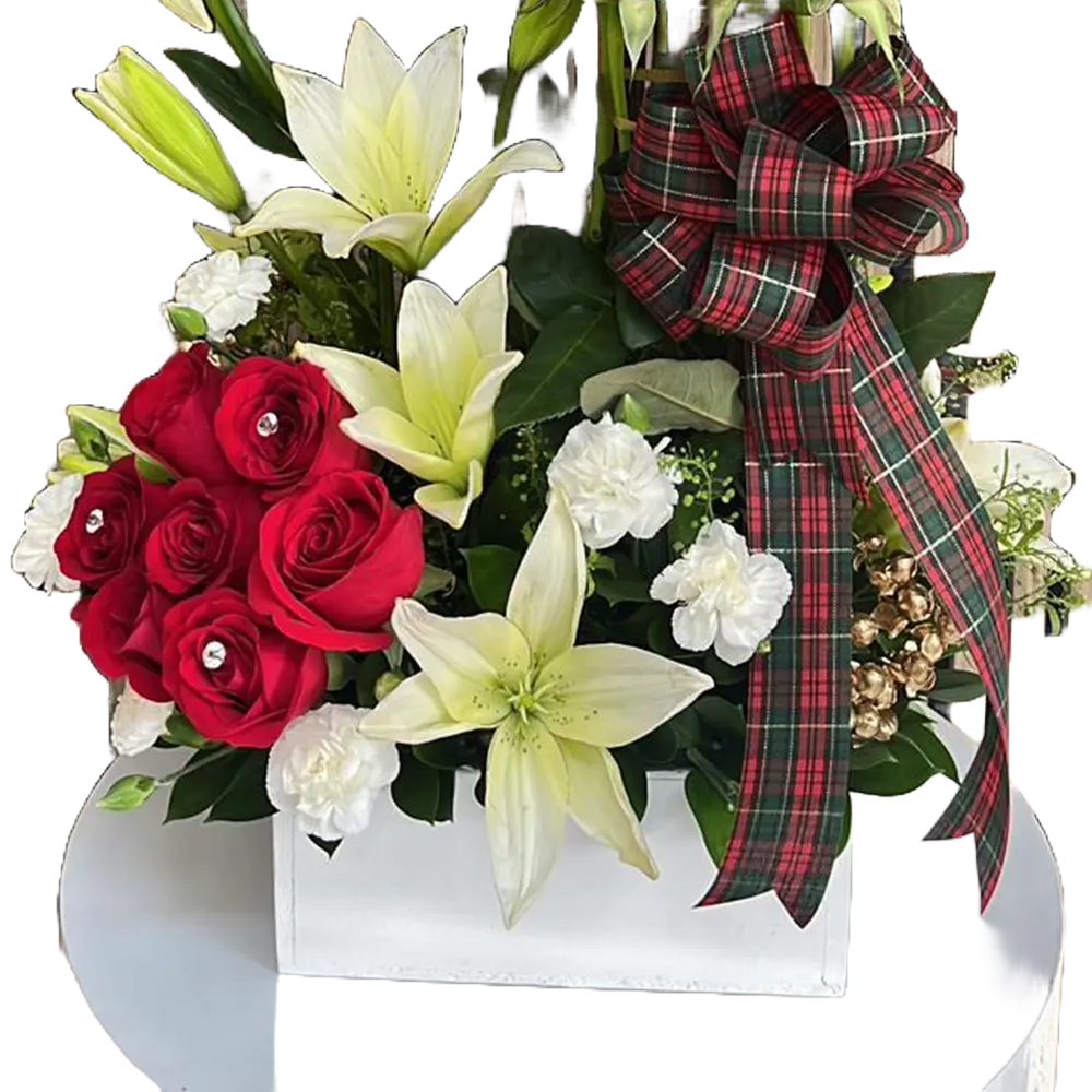 
                  
                    This image represents the details of our Christmas flowers and their white wooden base, our arrangement is made with red roses and white lilies on a white wooden base. Our flower shop is located in Miami and Bogota. Bouquets Flowers.
                  
                