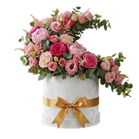 Elegant pink flowers box with roses and soft blooms for congratulations gift