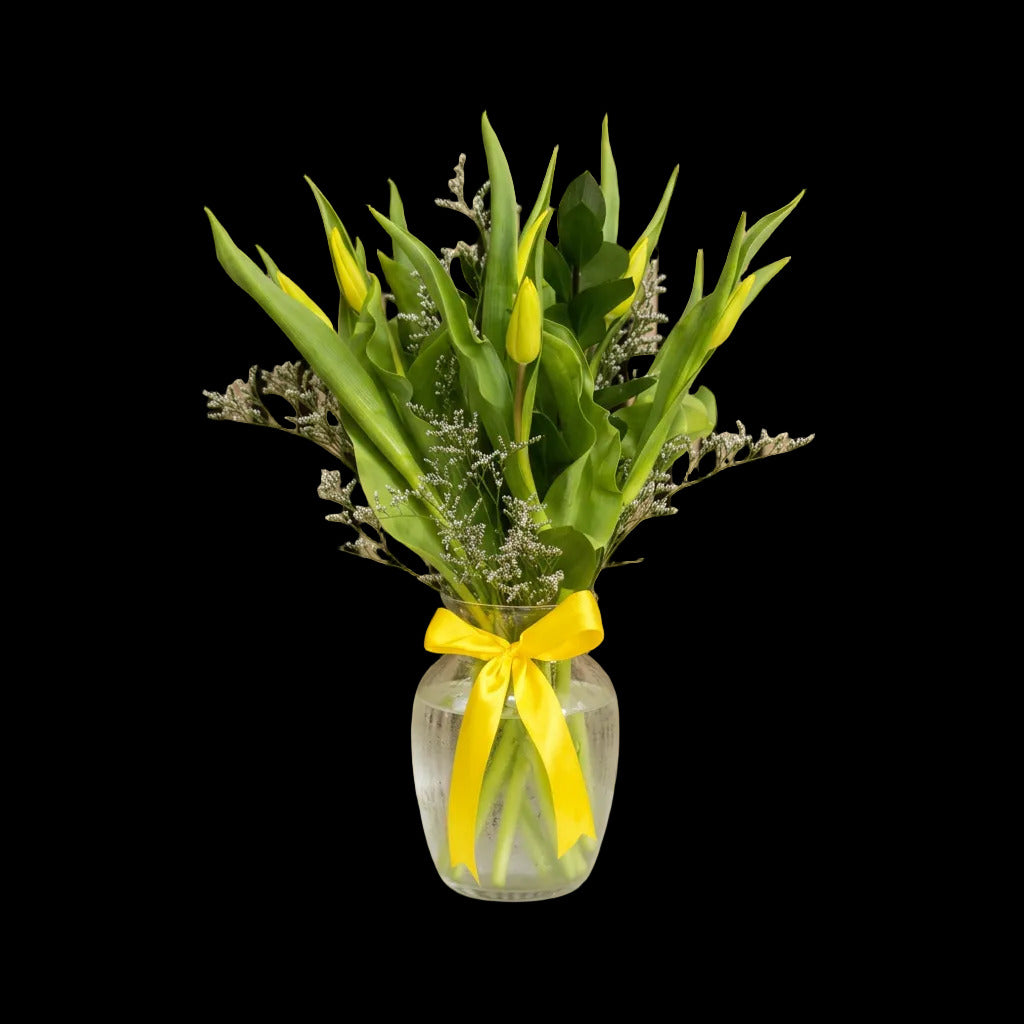 en fresh tulips arranged in a vase for a simple, elegant floral gift.
