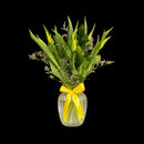 en fresh tulips arranged in a vase for a simple, elegant floral gift.