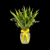 en fresh tulips arranged in a vase for a simple, elegant floral gift.