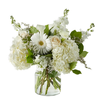 Rustic Mother’s Day flower basket with warm seasonal blooms and natural texture in Miami 