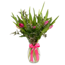 Florist-arranged vase containing 10 fresh tulips, presented as a ready-to-give flower arrangement.