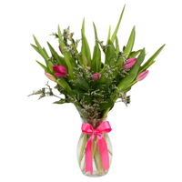 Florist-arranged vase containing 10 fresh tulips, presented as a ready-to-give flower arrangement.