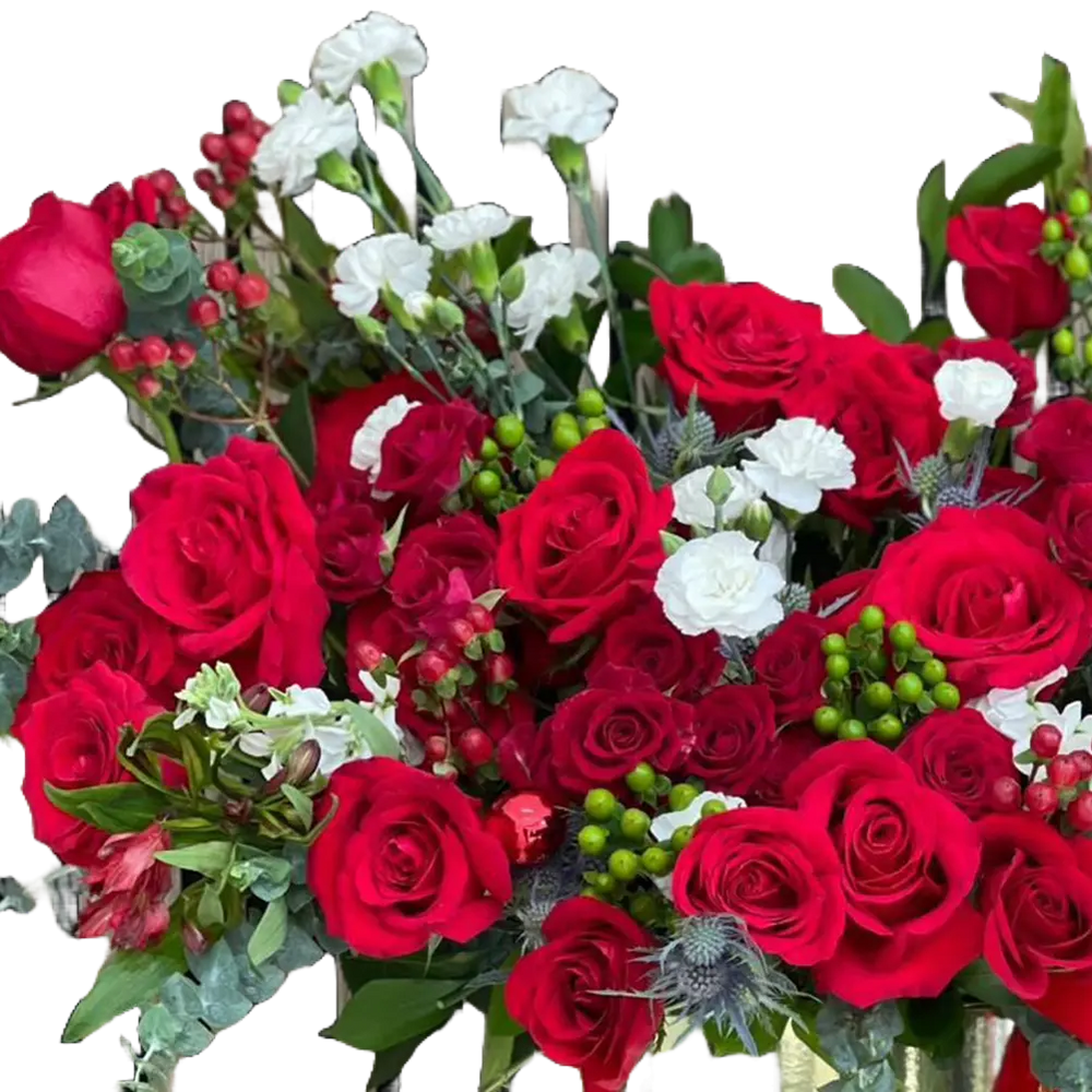 Reference image in detail for our seasonal flower arrangement “Merry Golden Christmas” made with red roses, green and white tones that will make this arrangement the special gift of this season.