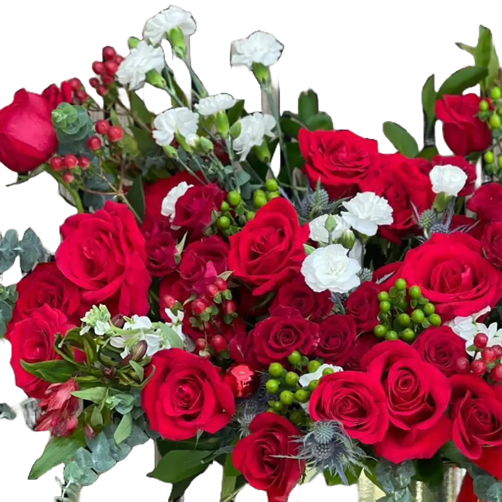 Reference image in detail for our seasonal flower arrangement “Merry Golden Christmas” made with red roses, green and white tones that will make this arrangement the special gift of this season.