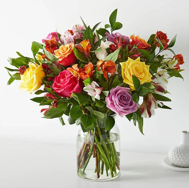 Bright mixed flower bouquet with roses in glass vase for same day delivery in Miami and Doral
