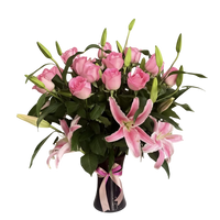 Elegant Mother’s Day flowers with pink roses and lilies in a glass vase delivered in Miami