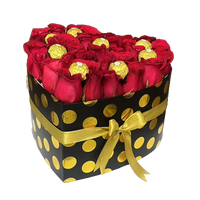 Image of heart-shaped box with red roses and chocolates chocolates, flowers gift for this christmas, Miami flower shop Bouquets Flowers Miami.