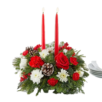 We present in this image our seasonal centerpiece, we made it with red roses, white carnations and daisies, the decoration is accompanied by two candles to decorate the dining table of your home. Our flower shop is located in the city of Miami. Bouquets Flowers, Size Standard.